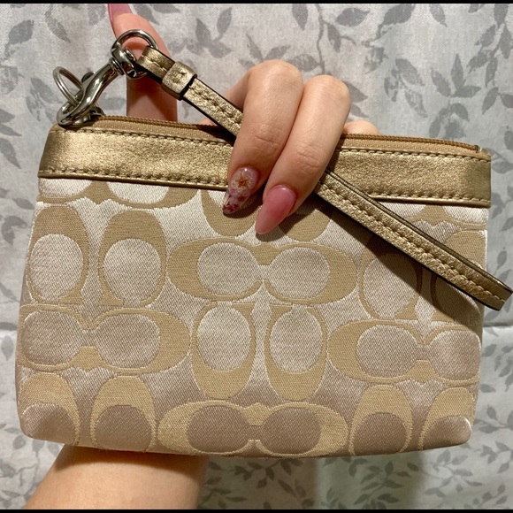 Coach Handbags - Gold Coach Wristlet